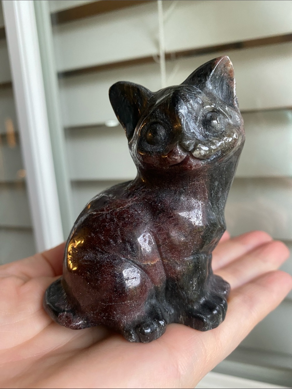 Garnet in Astrophyllite Cat carving